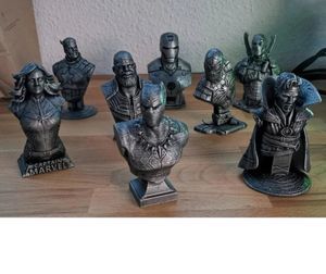 A collection of metallic-looking busts of popular Marvel heroes