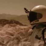 an astronaut looking over a horizon