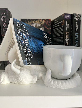 White dragon book and cup holder