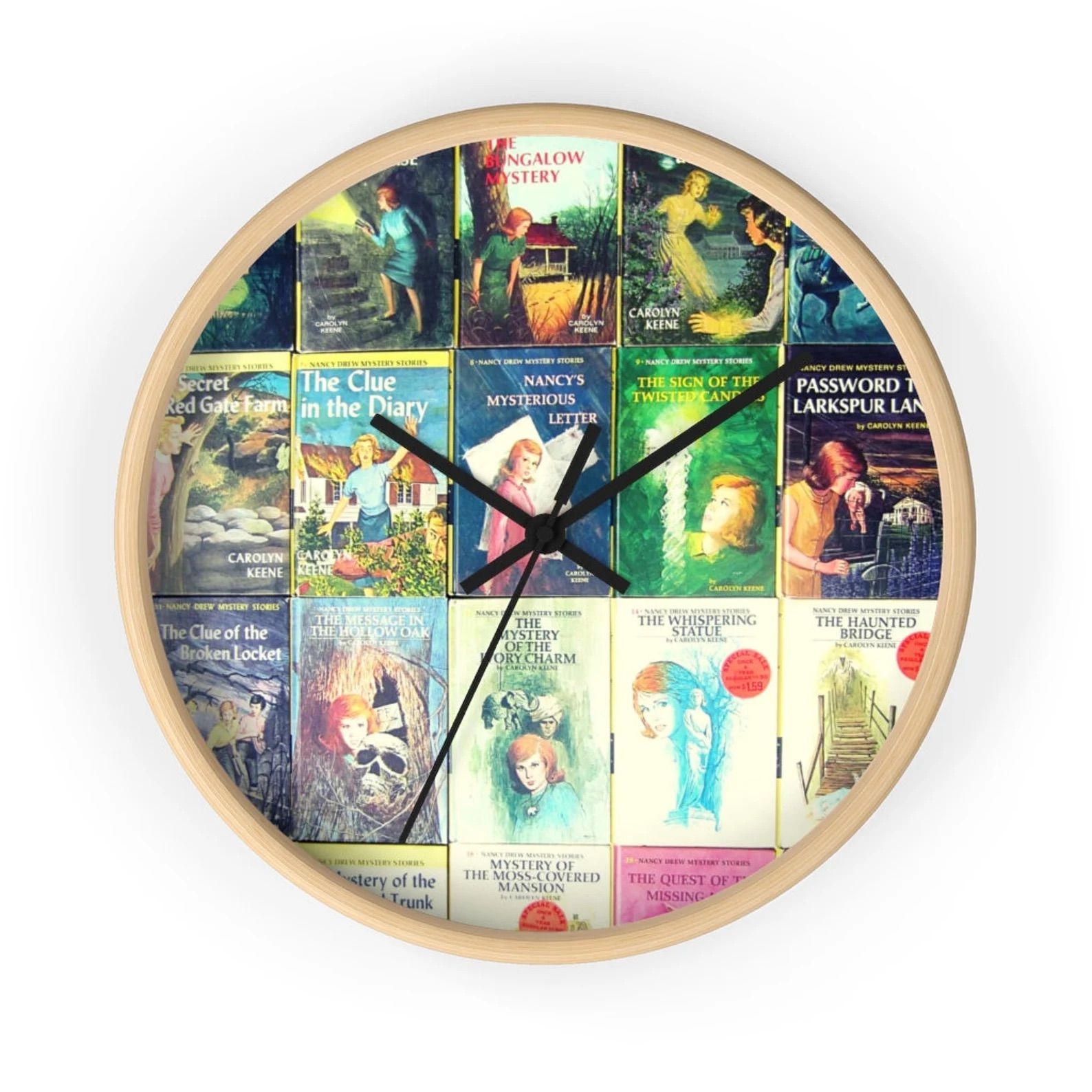 A wall clock with nancy drew covers on a white wall.