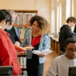 a diverse group of people at the library