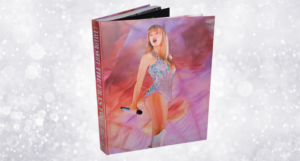 Taylor Swift The Era Tours book against a sparkly background