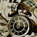 collection of wall clocks and alarm clocks