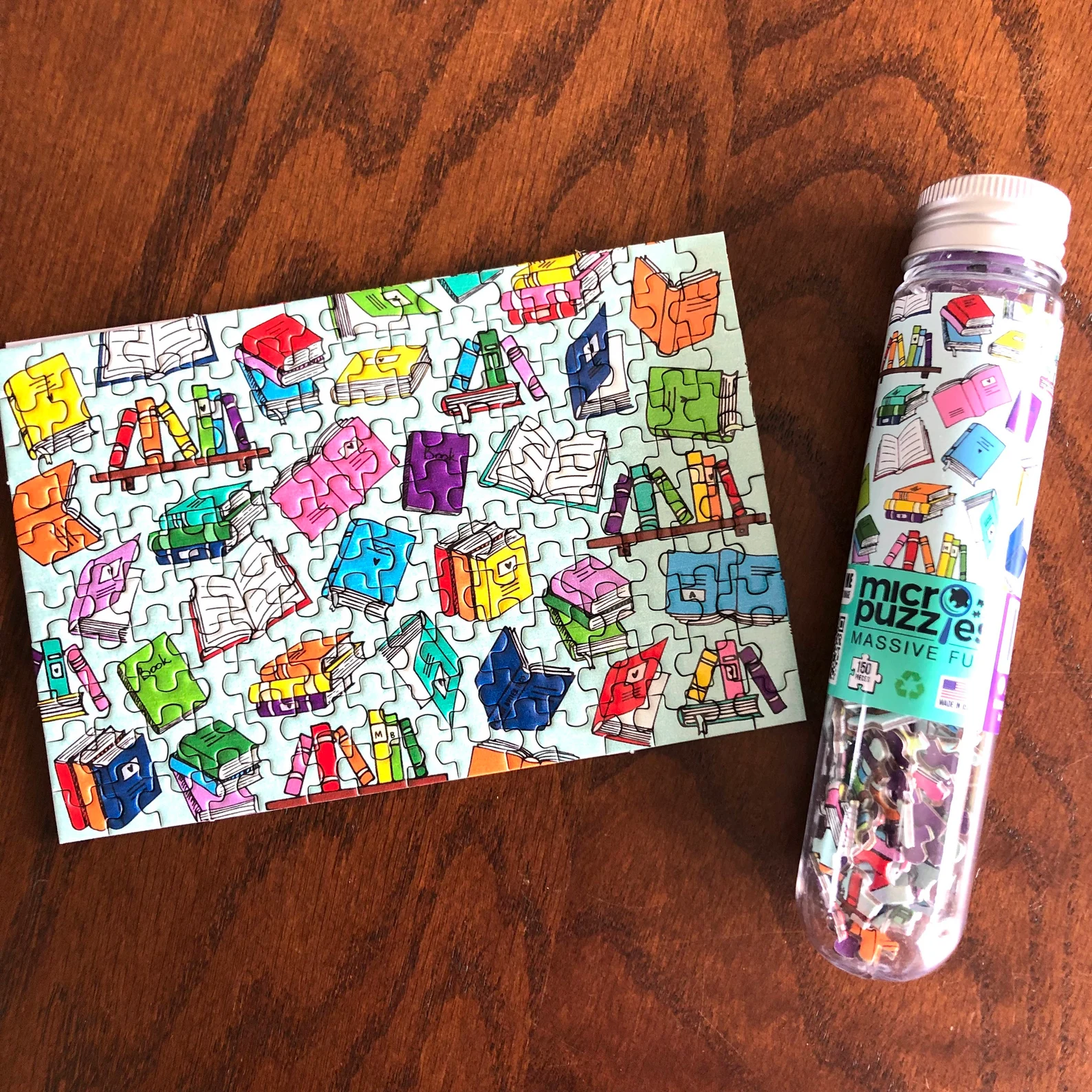 a mini puzzle of 150 little pieces featuring colorful books.