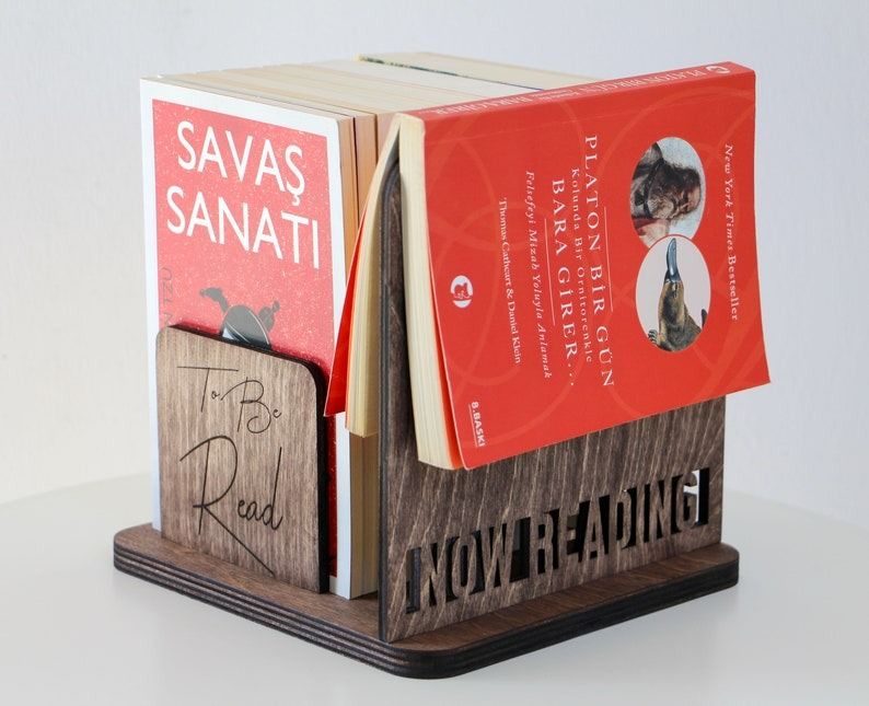 a square Book Organizer with space for a small shelf of books and a currently reading book