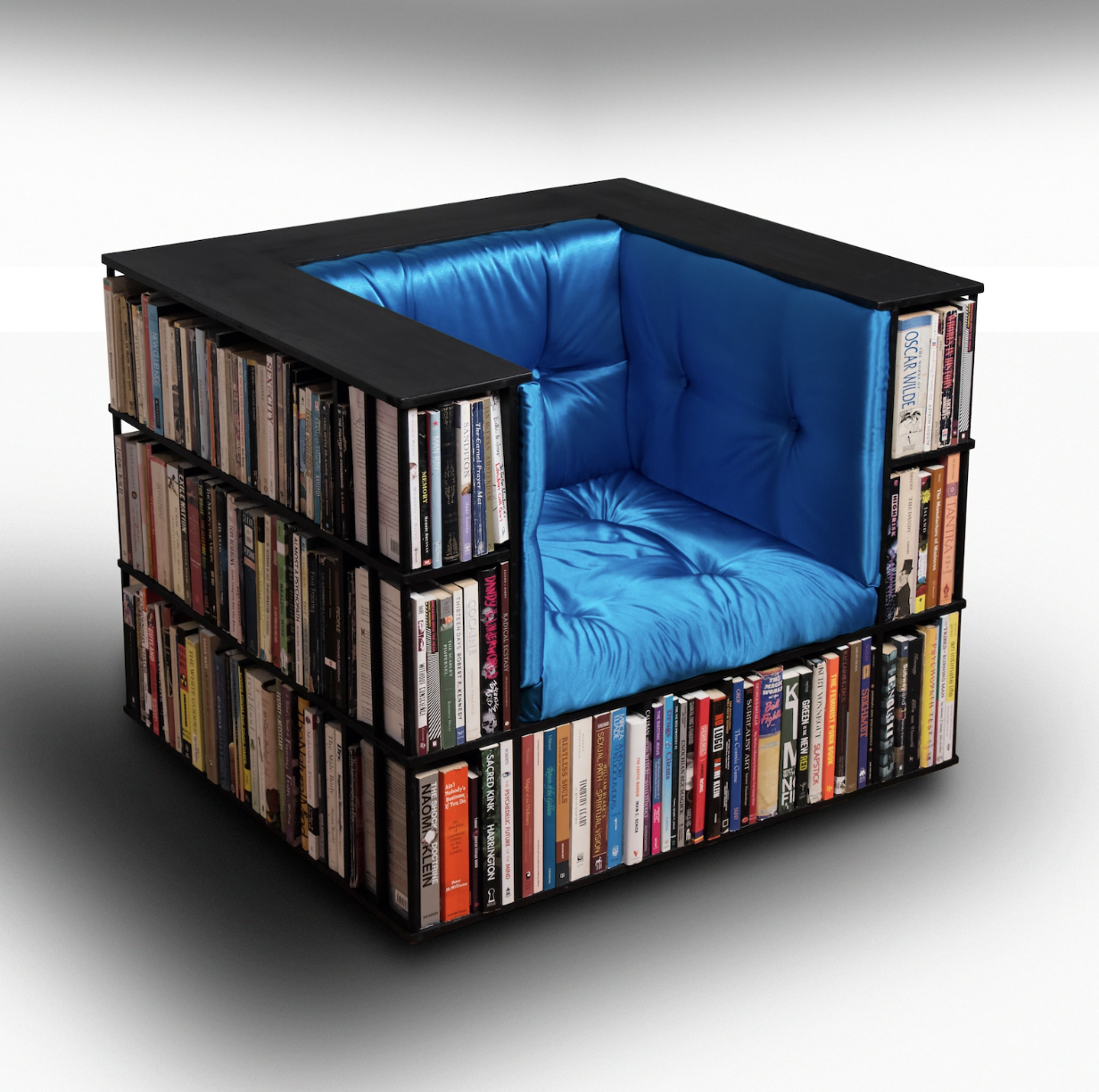 Photo of a cube-shaped chair with bookshelves around the outside and bottom