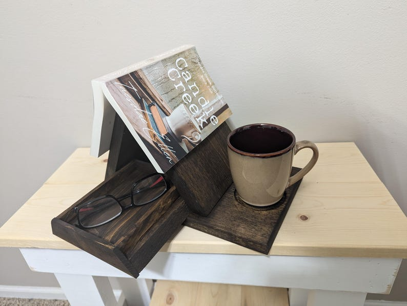 a wooden book rest with a drawer