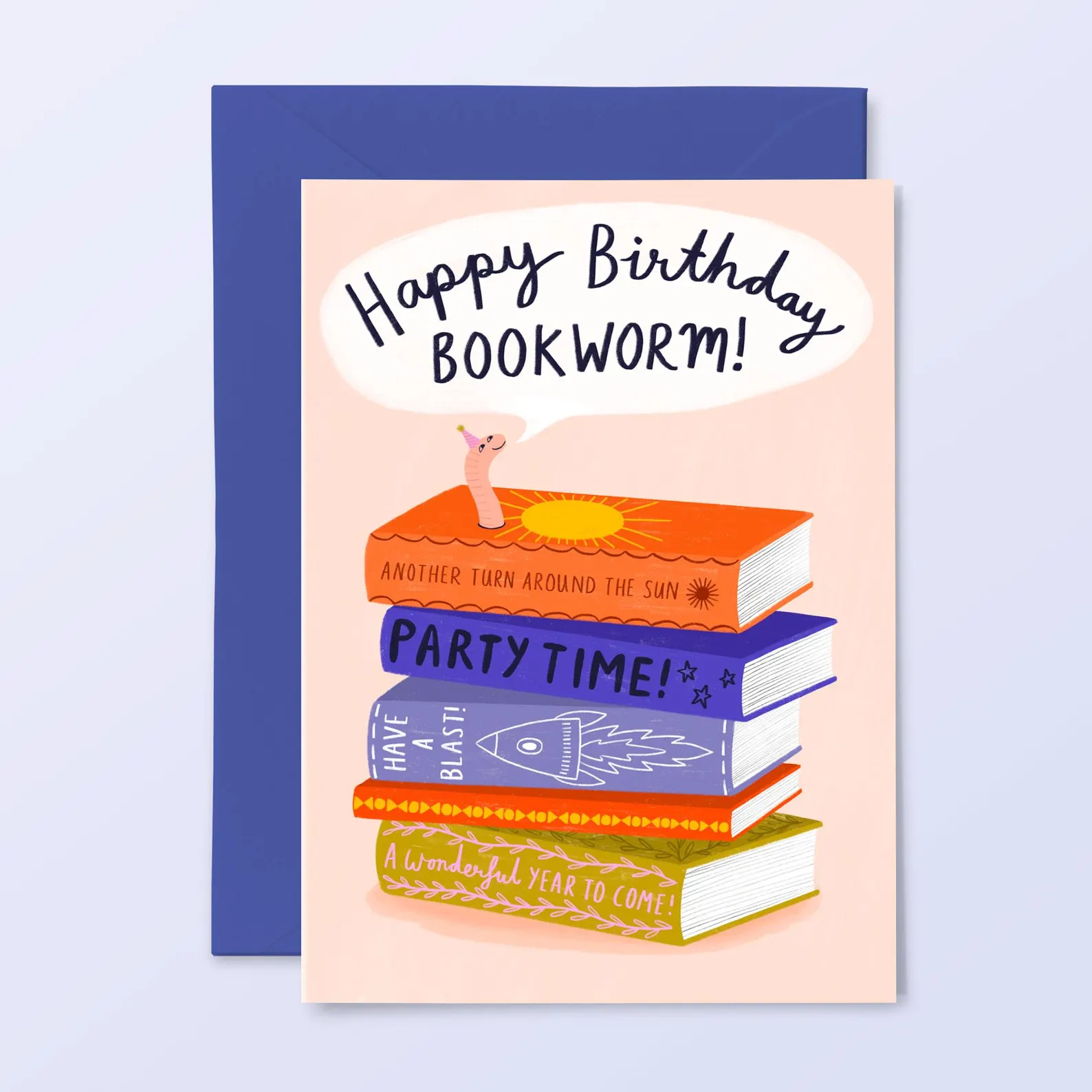 Image of a birthday card with a stack of books. Popping out from the top of the book stack is a little worm that says "Happy birthday bookworm."