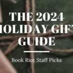 blurred image of a gift wrapped in green paper with a twine bow. Text over the image reads "The 2024 Holidat Gift Guide, Book Riot Staff Picks"