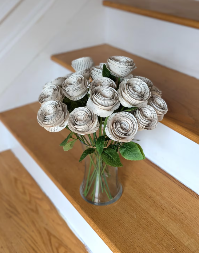 Roses made of paper in a vase on stairs