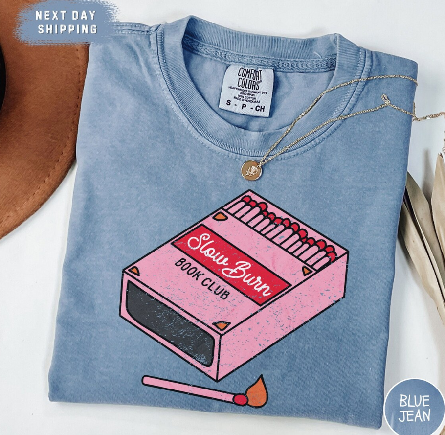 Blue t-shirt that reads "Slow burn book club"