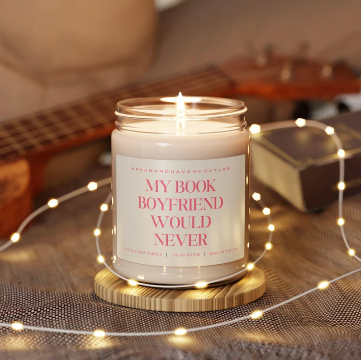 Candle that says "My book boyfriend would never"