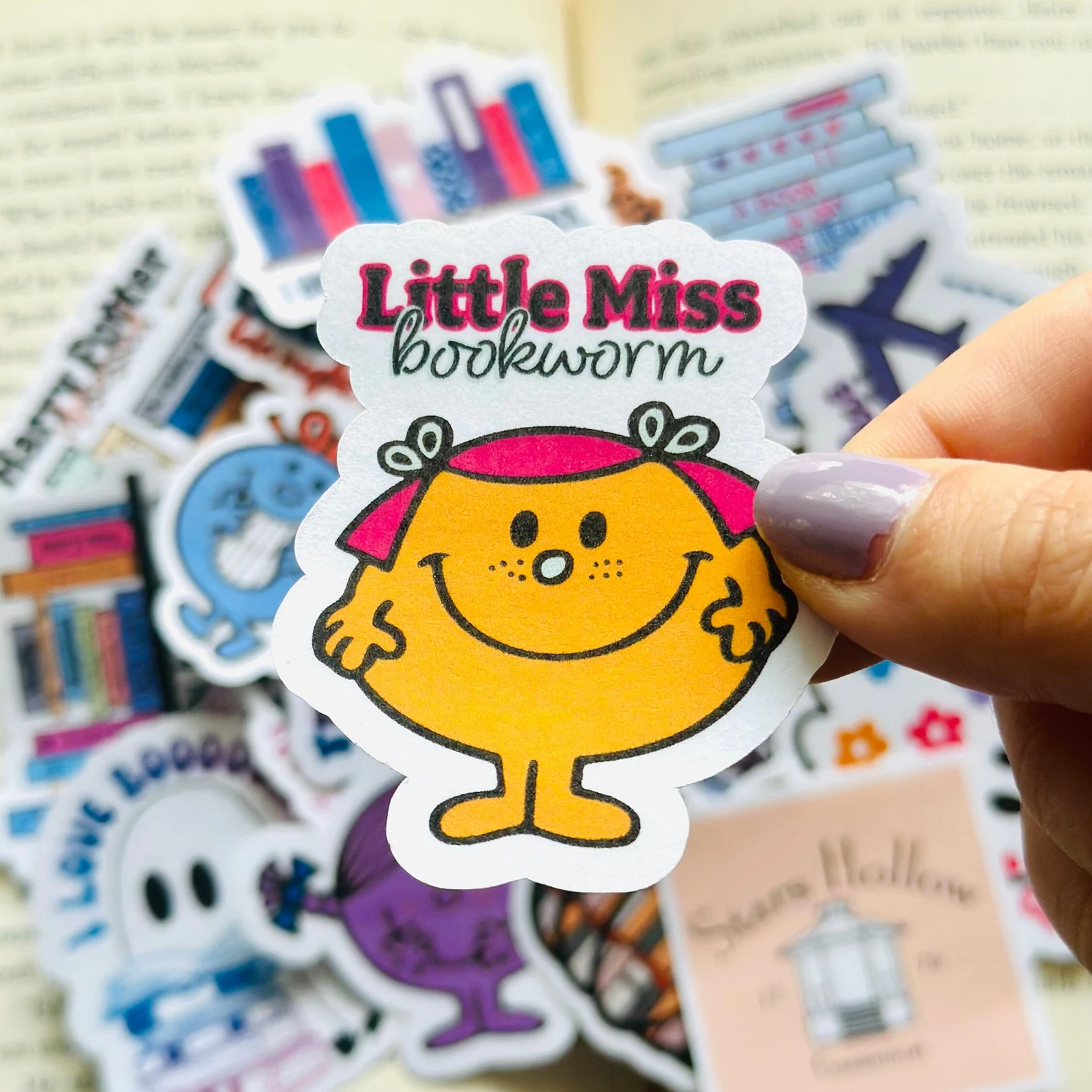 Sticker that says "Little Miss Bookworm" and features the iconic "Little Miss" style character. 