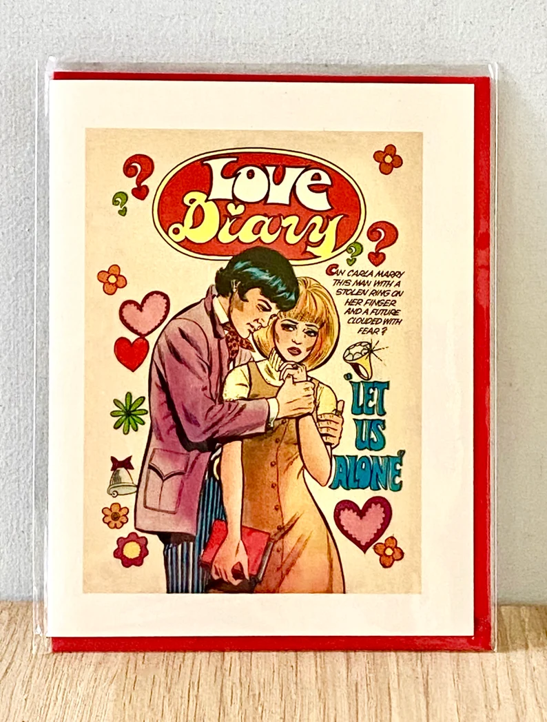 Pulp novel cover printed on card with a hugging couple and the title "Love diary"