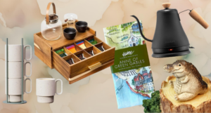 a collection of tea goodies, including a kettle, mugs, and tea organizer