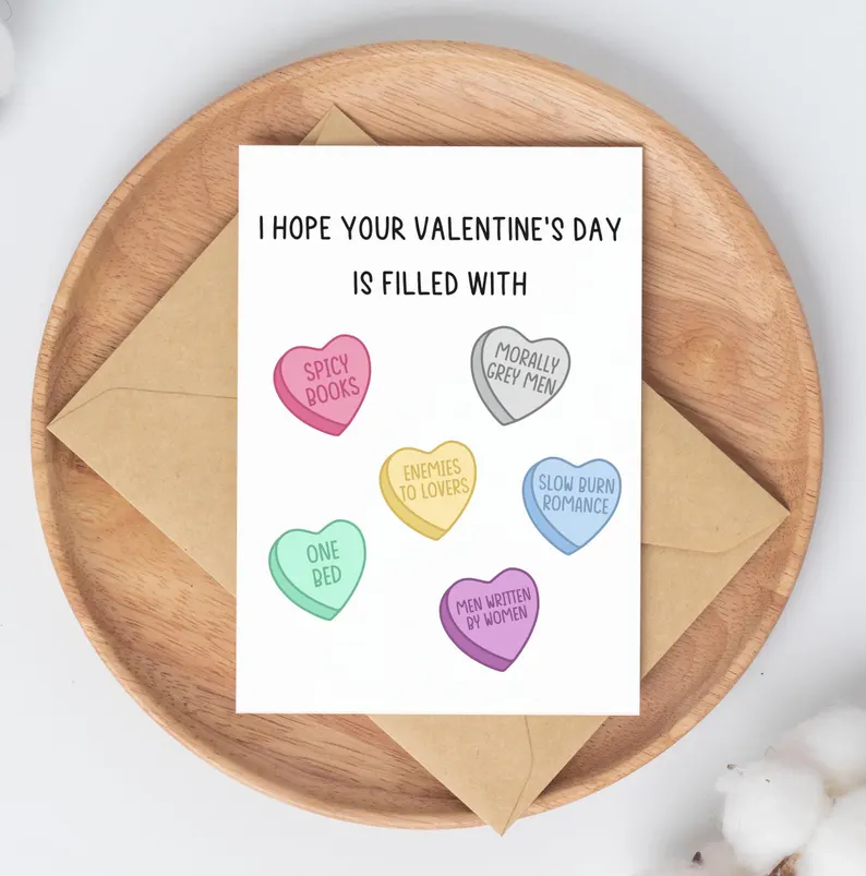 Valentines card with candy hearts each of which features a romance novel trope