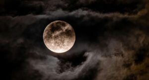 full moon against backdrop of stars feature