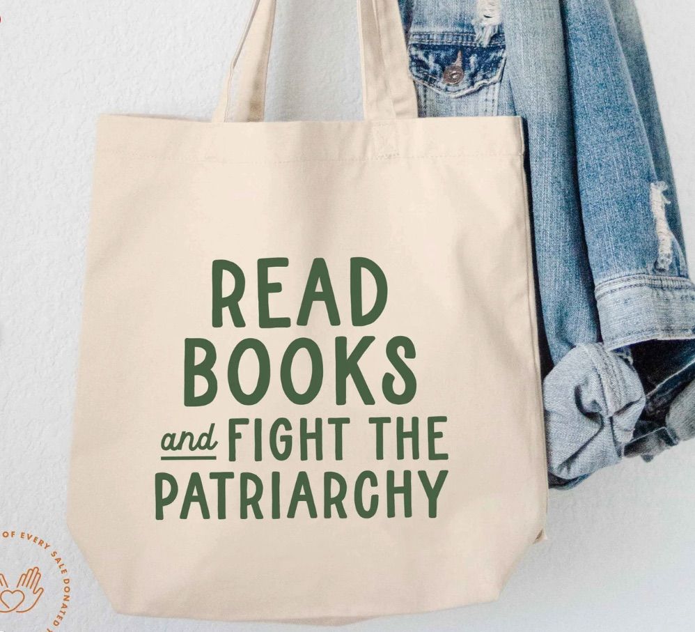 image of a canvas tote bag that says read books and fight the patriarchy in green. 