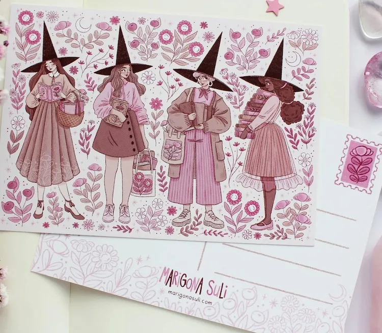an illustrated postcard in pink tones of four witches reading books