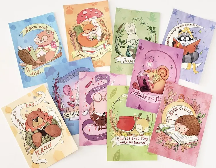 10 illustrated postcards with various animals reading books