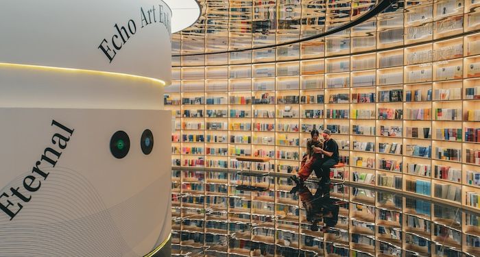 a bookstore or library with reflective ceilings and floors