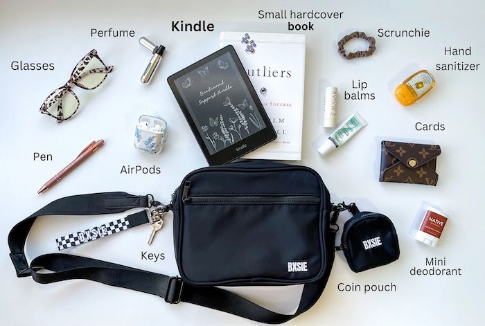 a black belt bag with key and coin pouch attachments