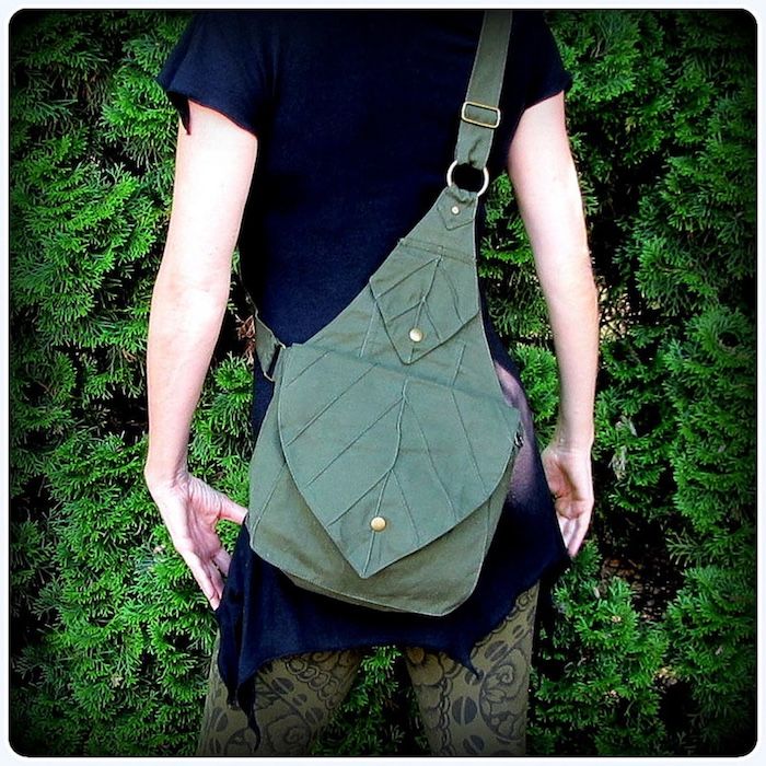 a green backpack/messenger bag with two flaps in the shape of leaves