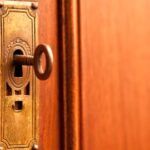 image of a skeleton key in a door lock