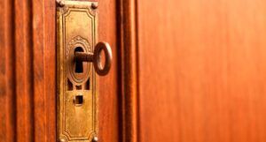 image of a skeleton key in a door lock