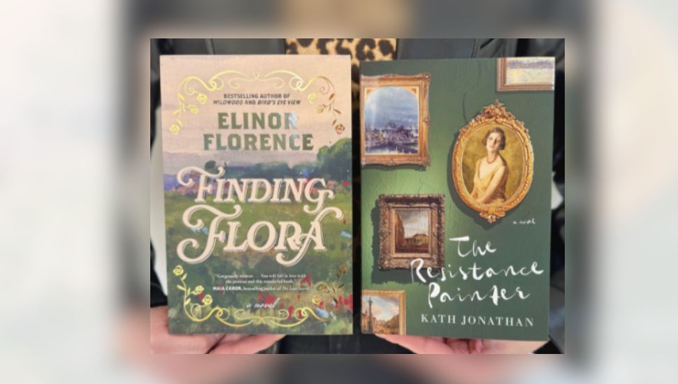 Picture of person with leopard print shirt holding copy of The Resistance Painter By Kath Jonathan and Finding Flora by Elinor Florence