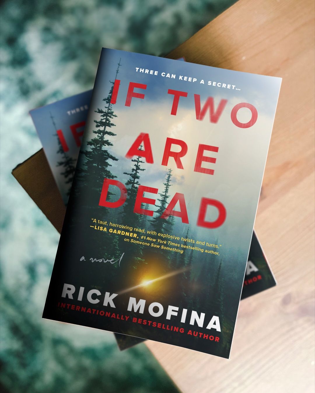 Cover of If Two Are Dead by Rick Mofina in triplet, each book stacked atop the next.