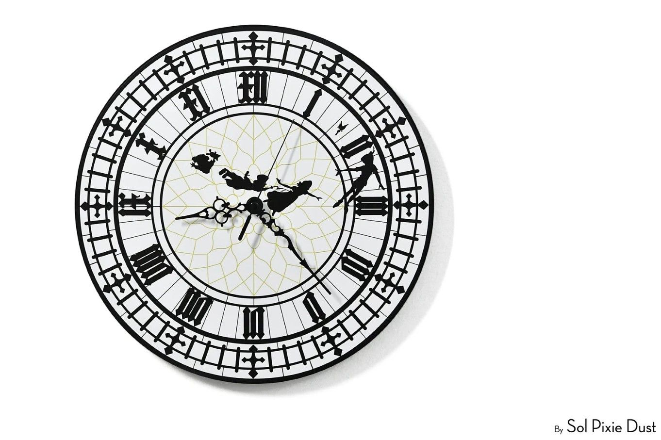 A black and white clock with Peter Pan characters on it