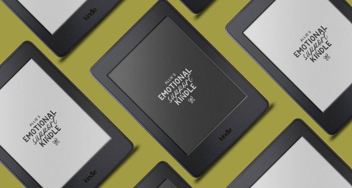 Kindles with custom white and black backgrounds that read "NAME's emotional support kindle" set in a diagonal pattern against a green background