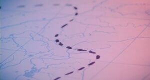 map with black inked tracks with blue and pink gradient overlay