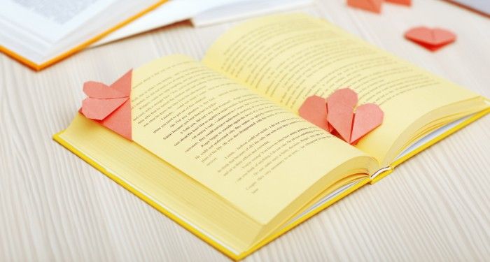 heart shaped origami bookmarks in a book