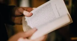 hands holding a book