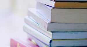 stack of books against blurred backdrop