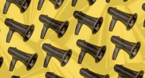 black megaphones against yellow background with semi-transparent books background
