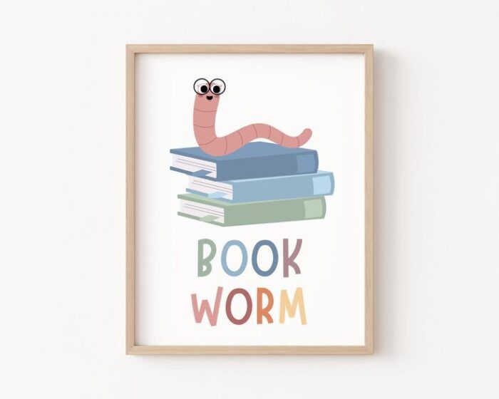 rectangluar print in muted primary colors with a white background. There is a stack of books with a worm wear glasses perched on top, and underneath are the words "Book Worm"