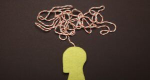 Image of a cutout person with a string coming out of its head