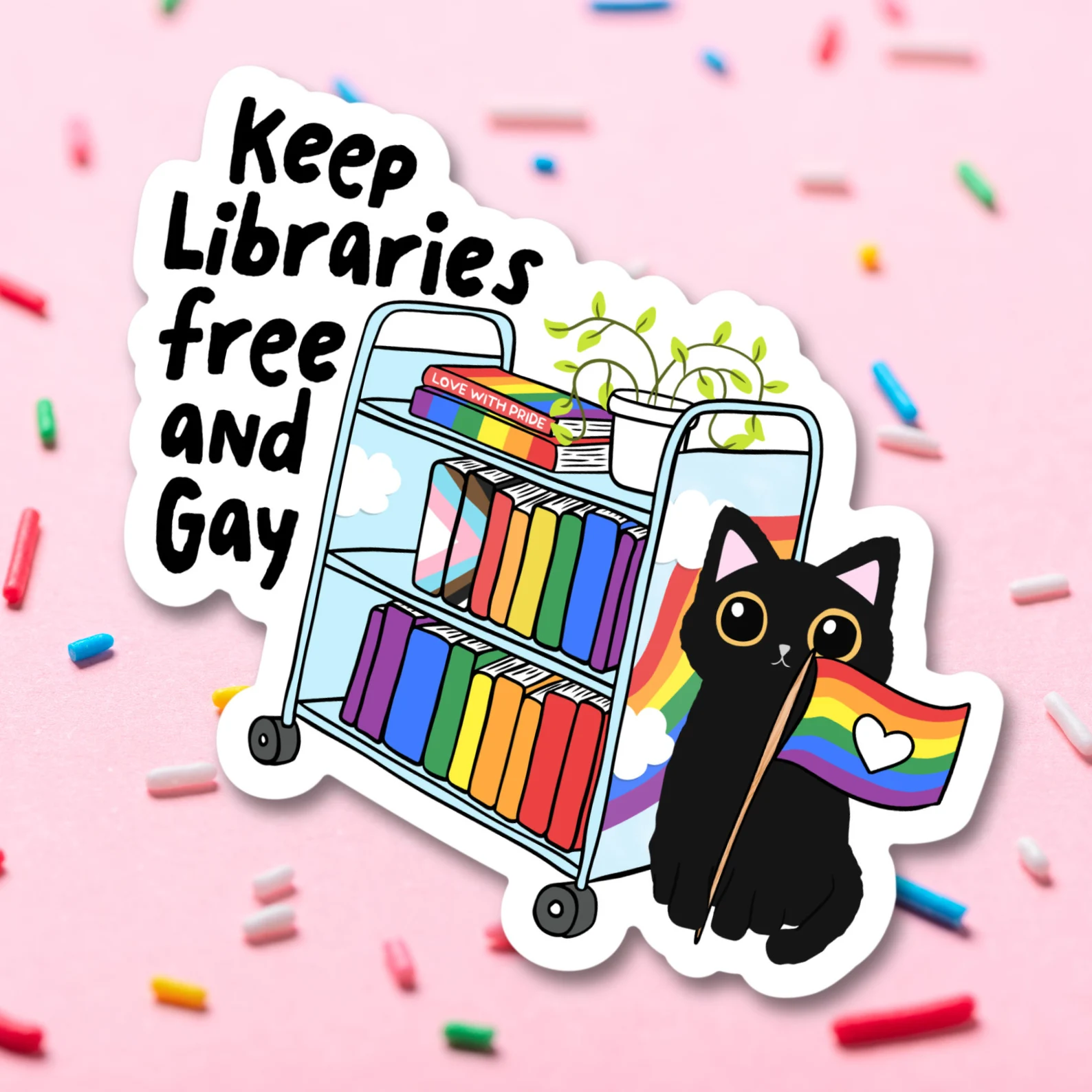 Image of a sticker. It is a bookcart with rainbow book spines on it. There is a black cat with a rainbow pride flag to the cart's left. To the right of the cart are the words "keep libraries free and gay."