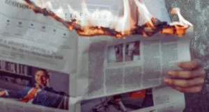 newspaper on fire