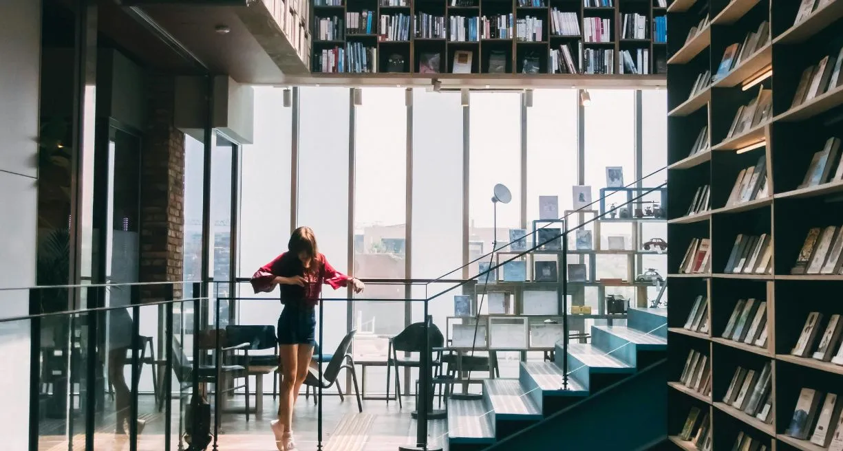 woman in Red Jacket Standing on the Stairs
