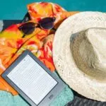 Black Amazon Kindle Tablet Near Brown Drawstring Sun Hat