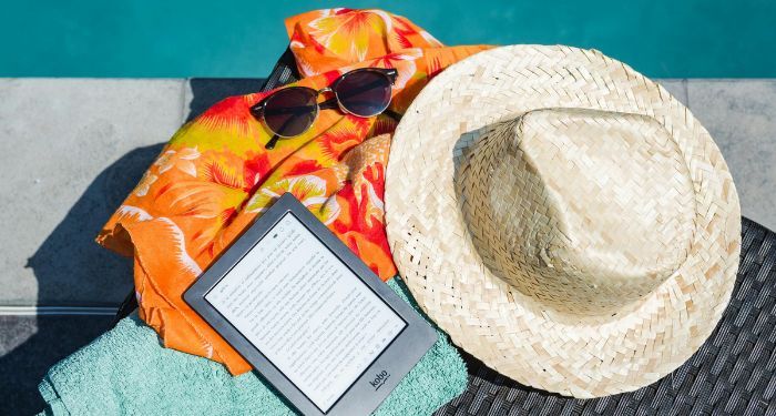 Black Amazon Kindle Tablet Near Brown Drawstring Sun Hat