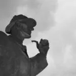 black and white image of a Sherlock Holmes statue in London, England