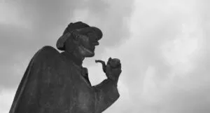 black and white image of a Sherlock Holmes statue in London, England