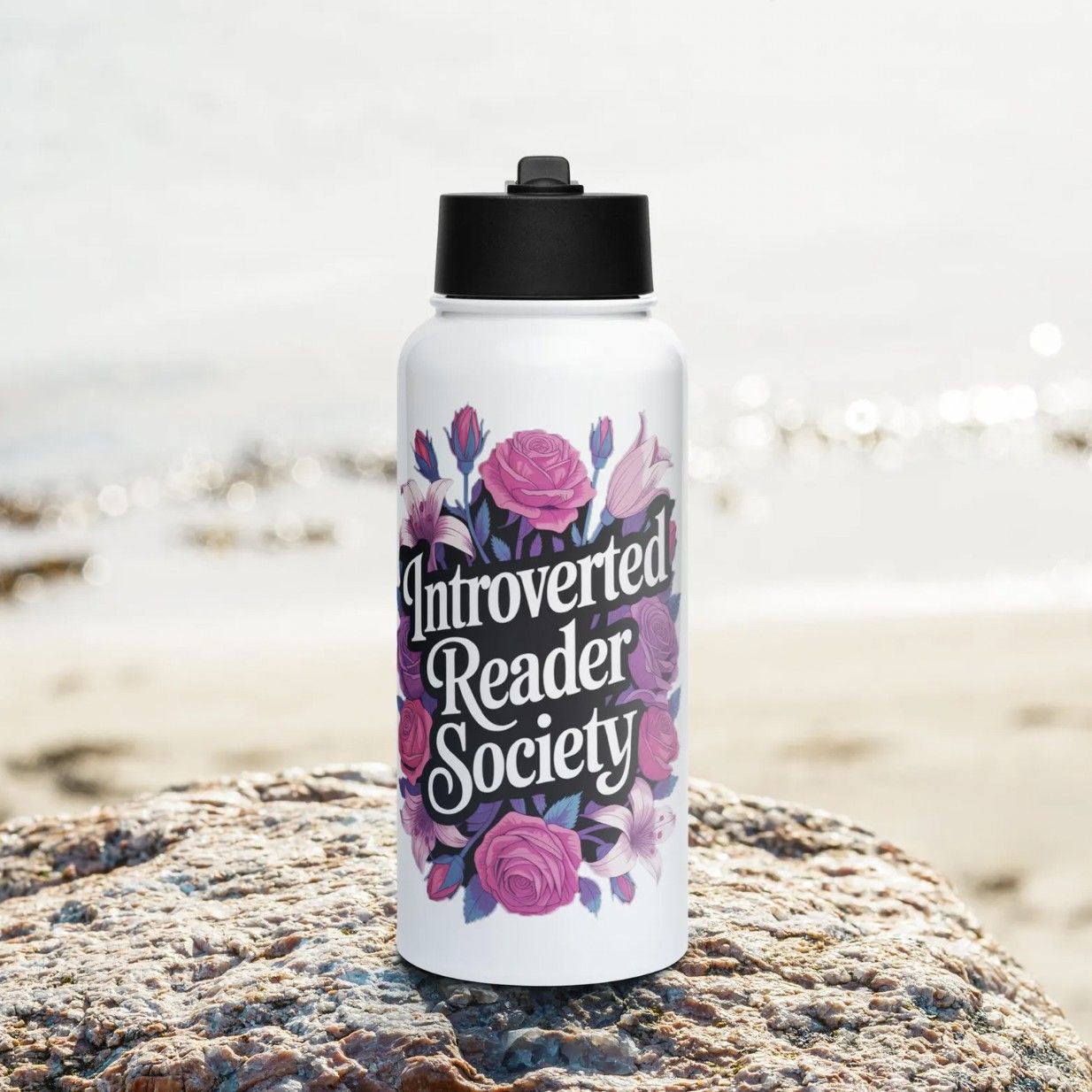Image of a stainless steel water bottle with a floral illustration and the words "introverted reader society"