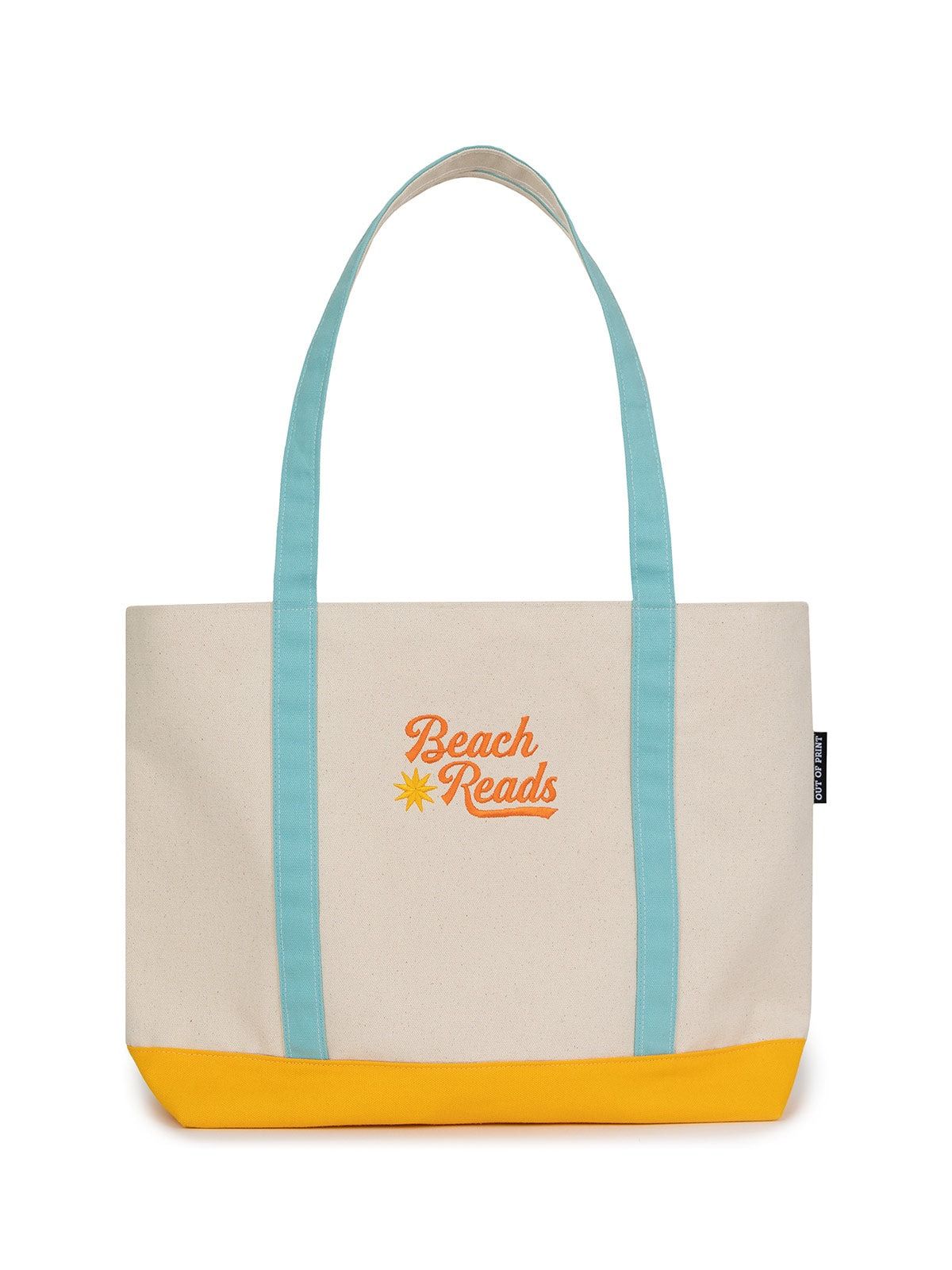 White tote bag with blue handles that says "Beach Reads"