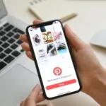 hands holding a phone with pinterest open